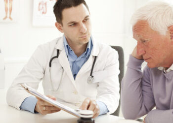 Worried senior man at doctor's office